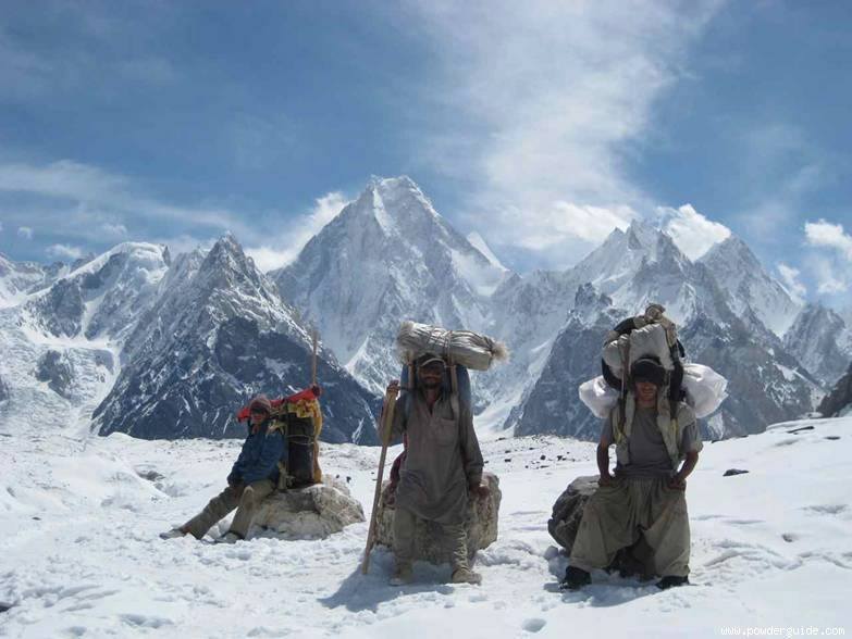 Porters with Gasherbrum IV in the background